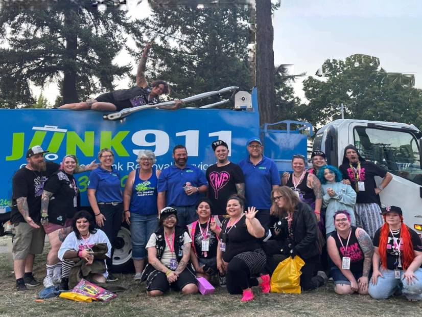 Junk911 dump truck with team and young adults in front at the Punx in the Park event